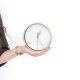 intentional time management - woman holding clock